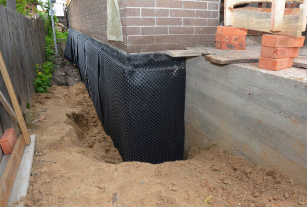 Happy homeowners after waterproofing job in Parker City